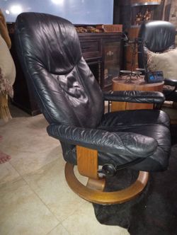 Two Leather Chairs that lean back and swivel with wood base