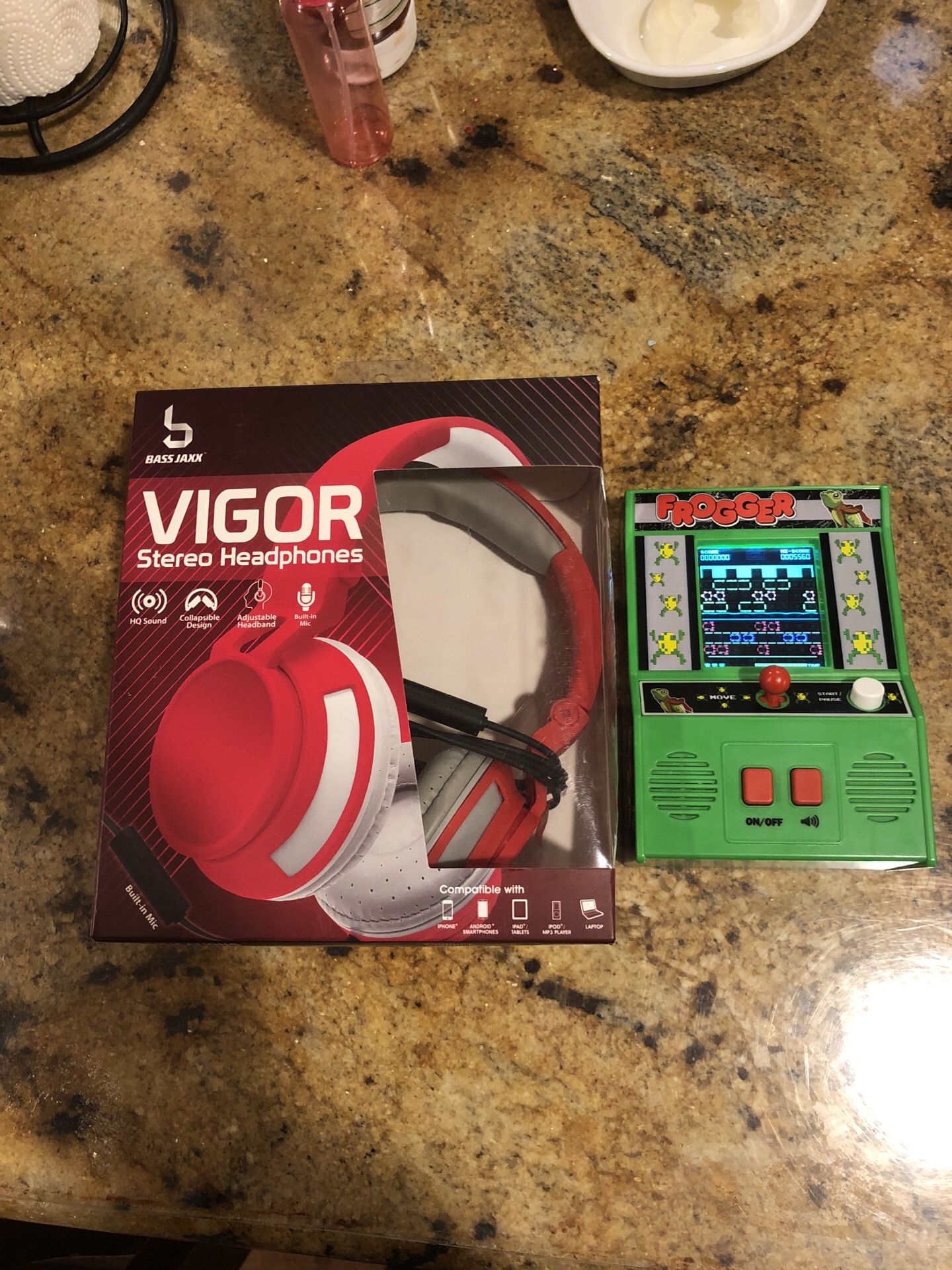 Kids headphones and frogger video game .