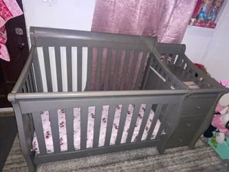 Grey baby crib