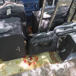 LOTS OF NICE PULL ALONG LUGGAGE 