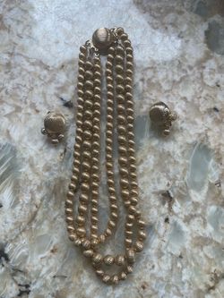 Triple chain gold beaded necklace with matching clip on earrings