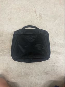 Sleek And Black Travel Bag For Essentials