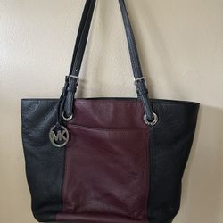 Michael Kors Large Jet Set Tote in a black and claret (burgundy) two-tone color