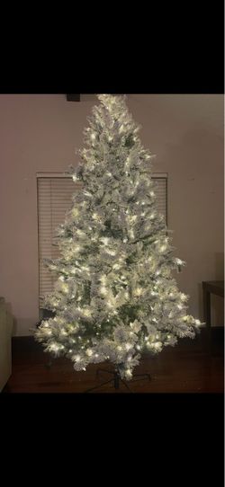9ft flocked pre-lit Christmas tree and ornaments