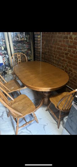 Solid wood table with four chairs
