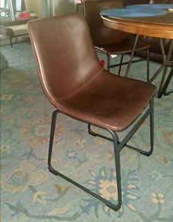 Chairs with brown seat and black base