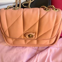 Teddy shoulder coach bag
