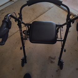 6 Mos Old Lightly used Rolling Walker