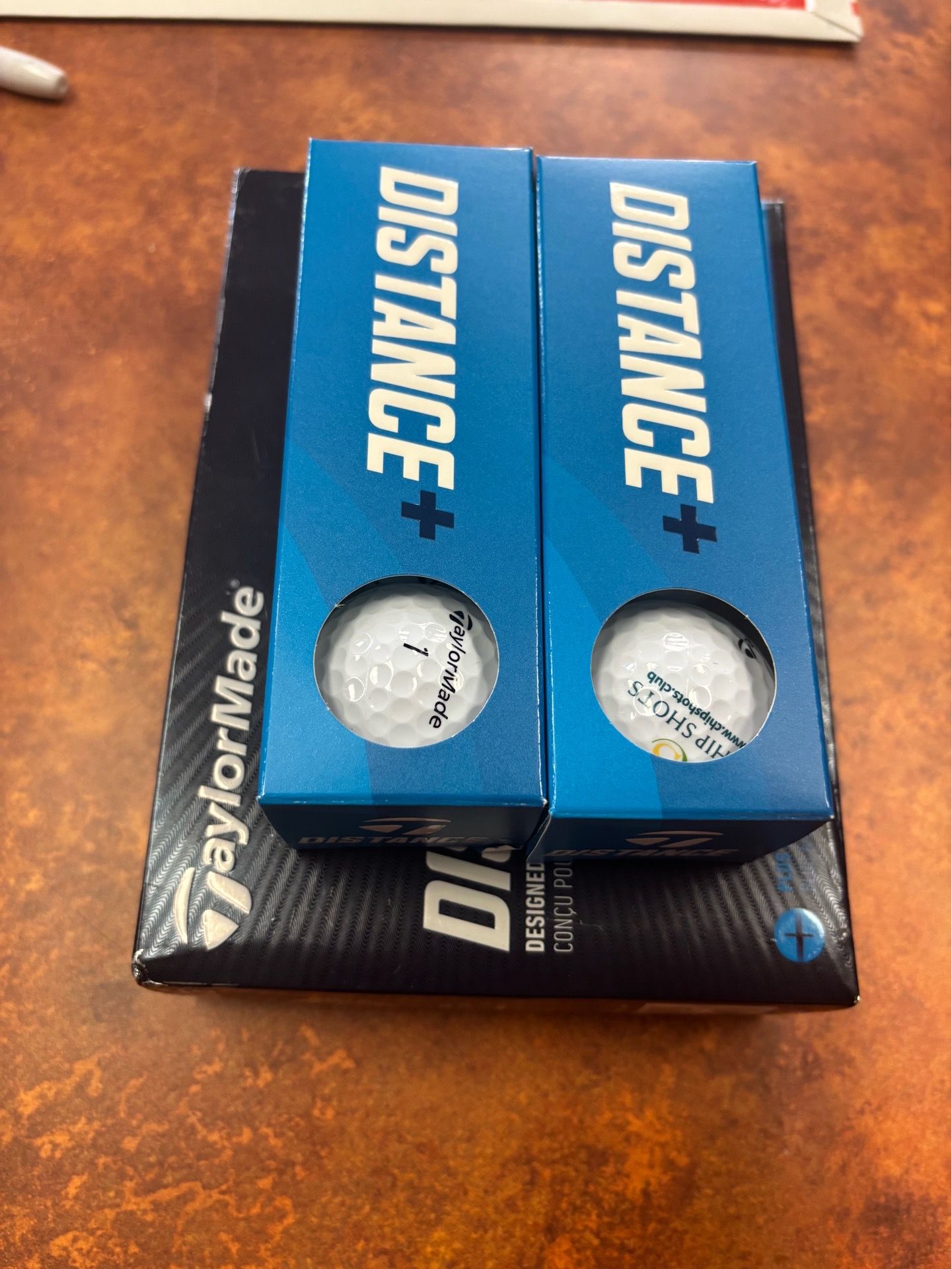 NEW TaylorMade Distance + Golf Balls - ChipShots Logo