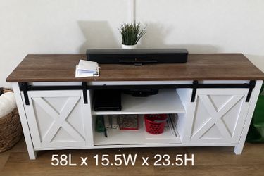 Farm style TV stand with sliding doors