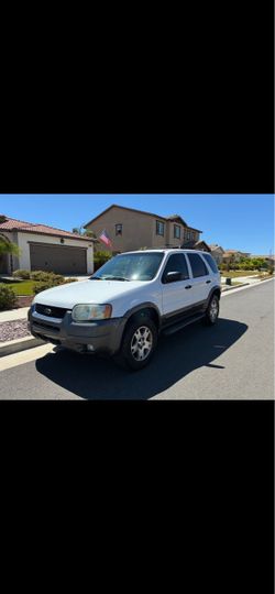 2004 Ford Escape XLT V6 182k miles runs great no issues no leaks cold ac tires are good new struts registration paid great vehicle for commuting or fo
