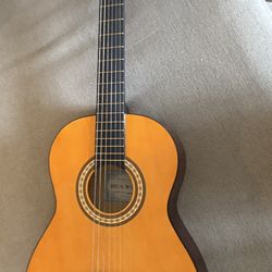 Small-size guitar for sale (used).