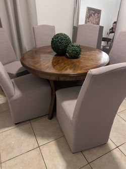 Round Wood Dining Table with 6 Upholstered Chairs