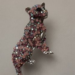 Decorative Panther brooch with pink rhinestones.