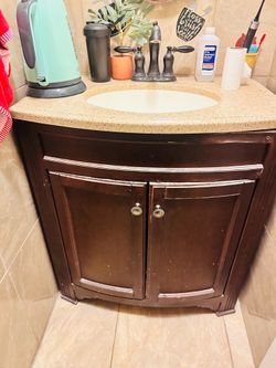 Bathroom cabinet with faucet