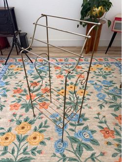Hollywood regency floor rack