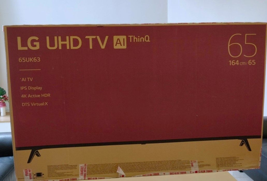65" 4K UHD Television in box