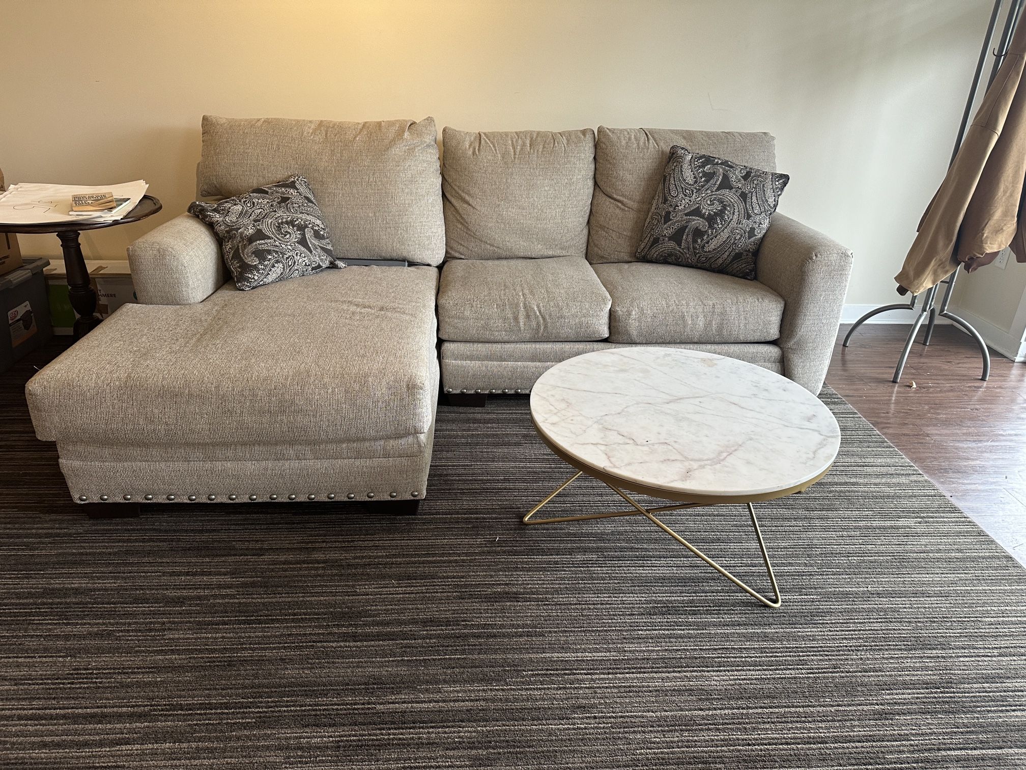 Two Piece Sectional With A Marble Coffee Table 