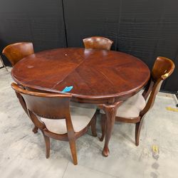 Traditional Dark Wood Oval Dining Table with Four Upholstered Chairs