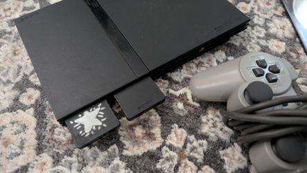 Sony PlayStation 2 slim  Bundle with Guitar Hero Controller and Games