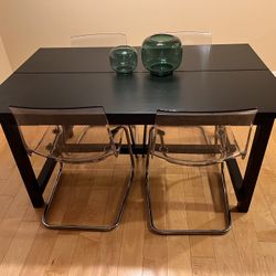 Extendable Black Wood Table And 4 Clear Chairs