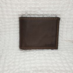 Levi Strauss slim line loaded leather wallet. Good preowned condition & smoke free home.  Measures  9" X 3" . 