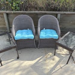 Outdoor patio chairs and side tables used
