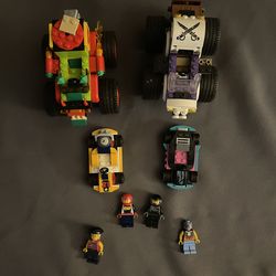 Two Lego monster trucks and two Lego go kart
