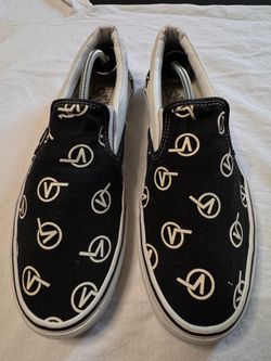 Vans black slip ons