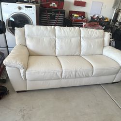 Coffee Table And White Leather Couch 
