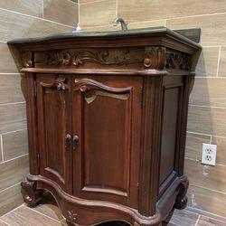 Bathroom vanity featuring a real marble countertop