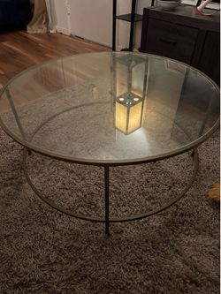 Glass coffee table with gold finish