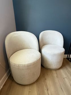 2 x light grey swivel chairs