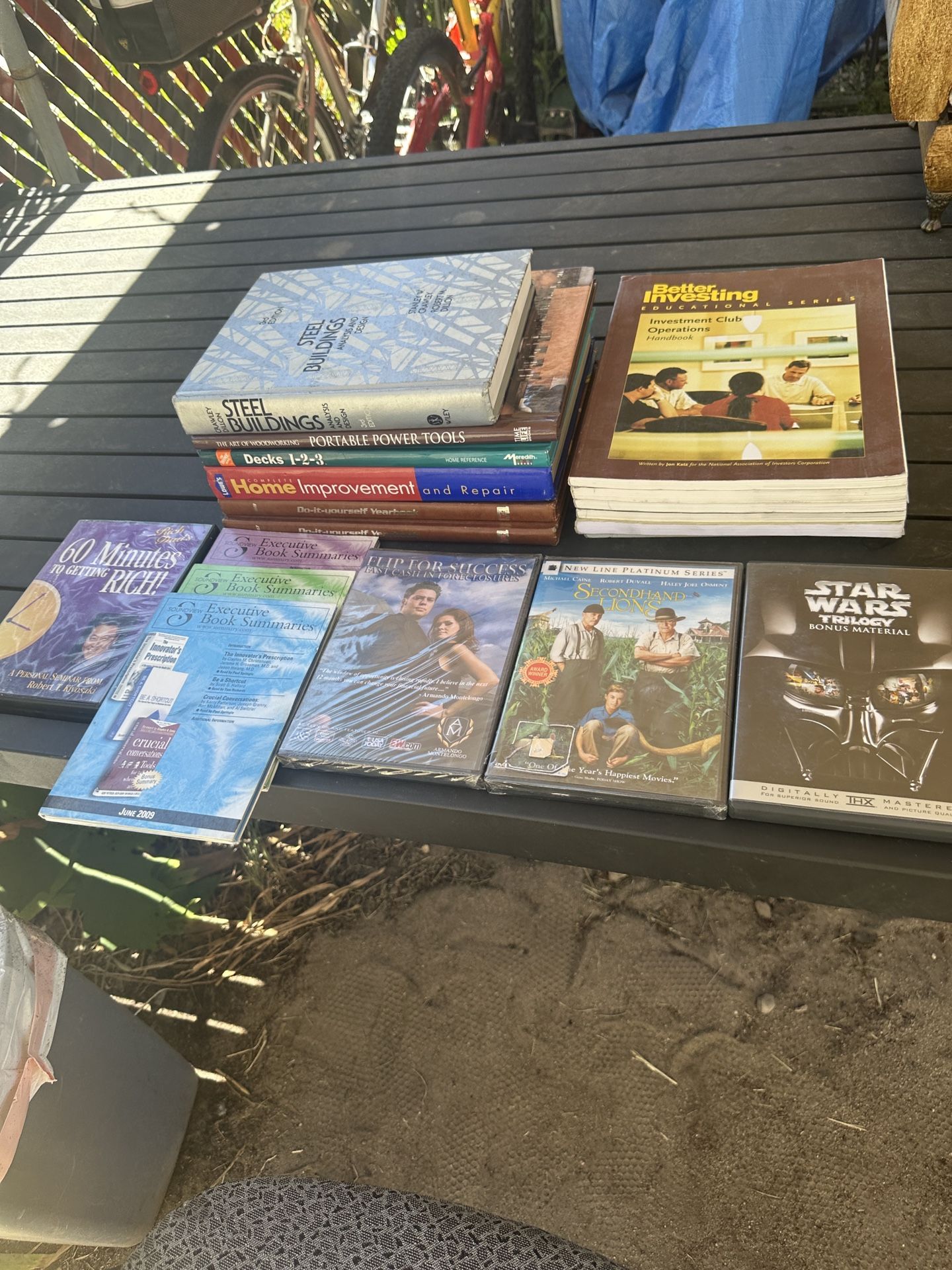 1 lot of DVDs, home improvement books, executive book summaries and investment magazines