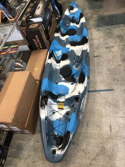 Two person kayak with paddles , backrests , hatches, rod holders and wheel