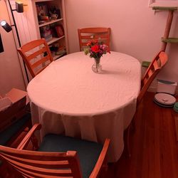 Solid wood dining table with 6 chairs and 2 leafs