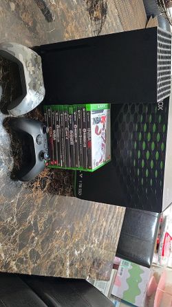 Xbox series x with cables games and controllers