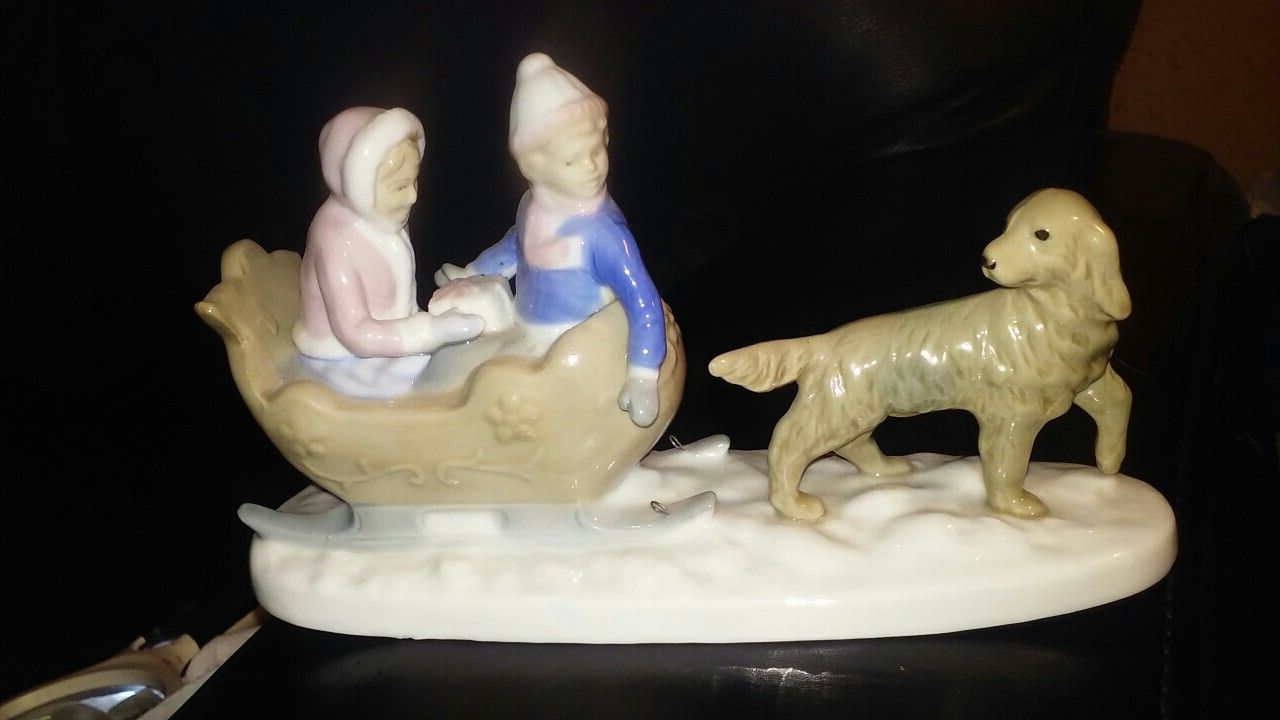 Vintage meico porcelain dog ,boy, girl. In sled figurine