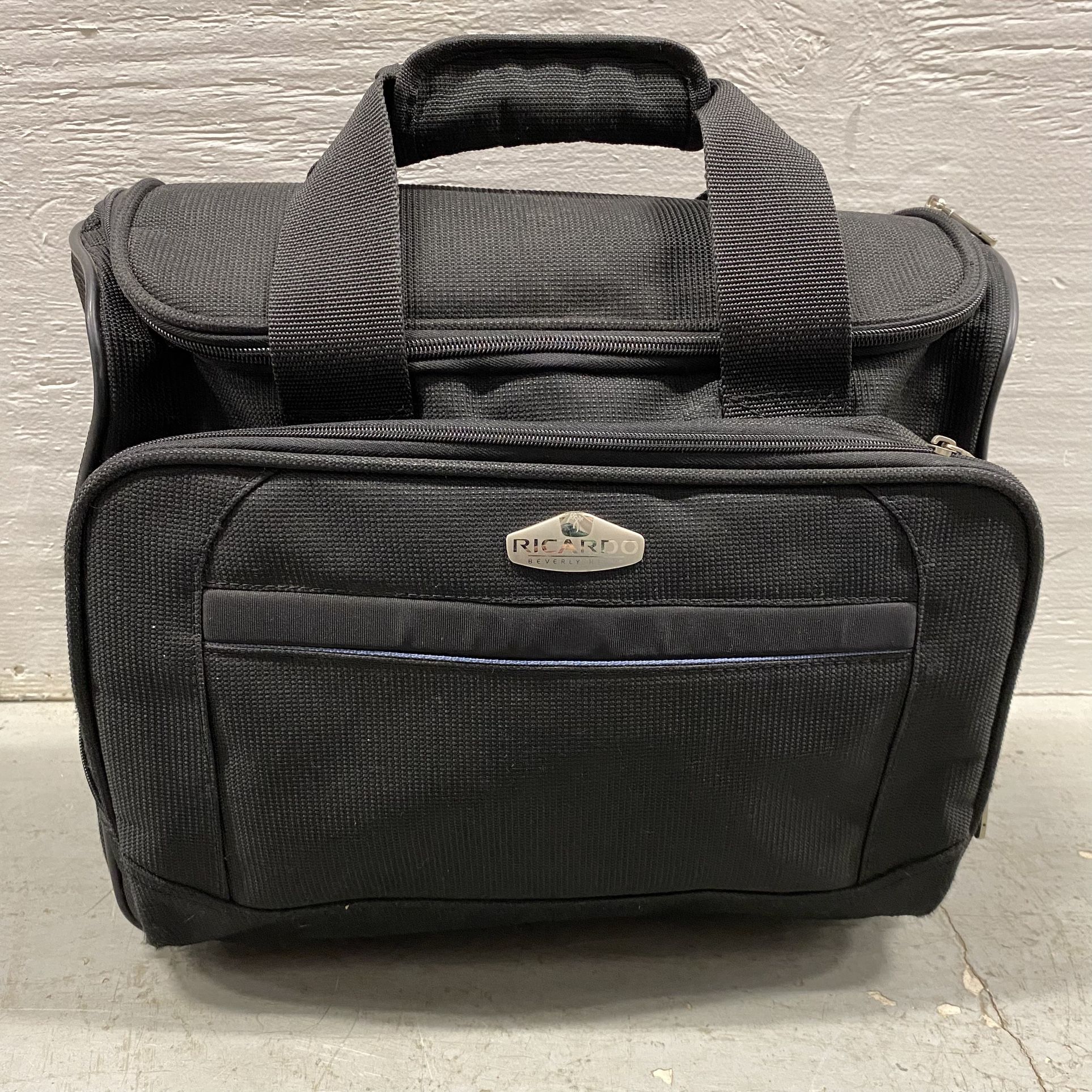  Ricardo Beverly Hills Black Carry-On Personal Item Travel Bag  Great pre-owned condition.   Measurements:  16” Wide x 13 1/2” Tall x 10” Deep  Pick u