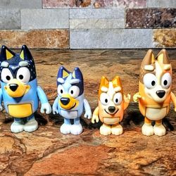 These are A 4- Lot Of The Bluey Heeler Family Action Figures Set • Characters Included Are : Bluey , Bingo , Bandit  , & Chill • These Figures Are Pos