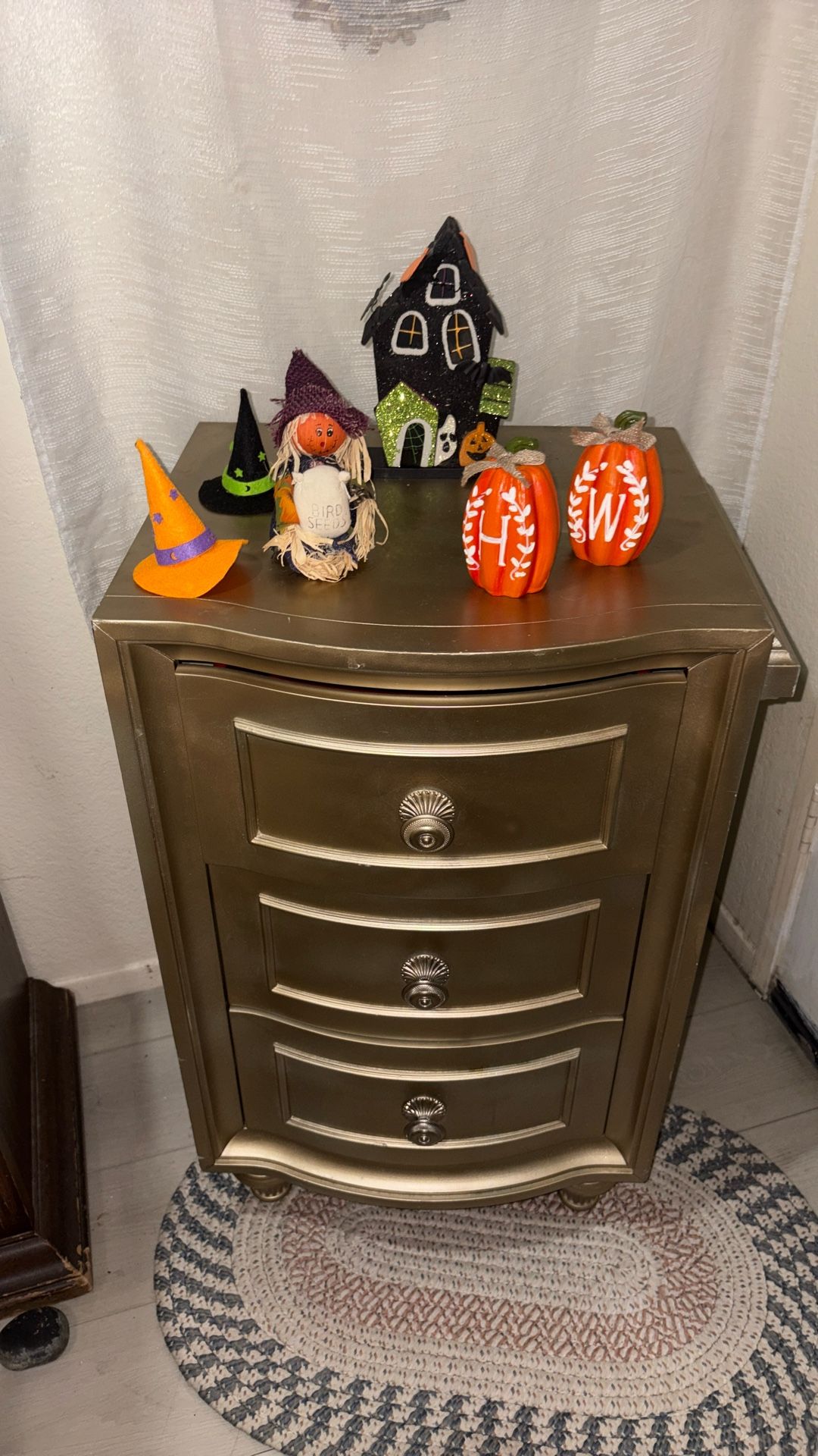 One gold dresser with Halloween decor