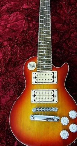 Mini Gibson “Les Paul” by Lotus New Older stock. Perfect. With factory padded case.