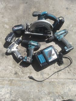 Makita cordless skill saw and drills and batteries