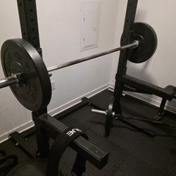 Rogue Squat Rack With Barbell And Weights