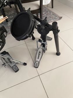 Electric kids drums set with sticks pads and stool.