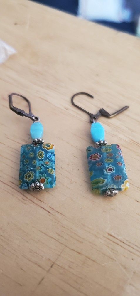 Vintage Pierced Earrings With A Blue Stone And Floral Covered Charm. 