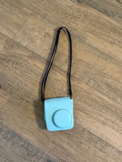 Light blue Fujifilm Instax Mini 11 camera case with black strap