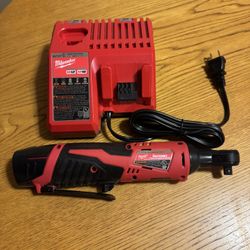Milwaukee Ratchet Tool W/ Battery Charger and a Battery