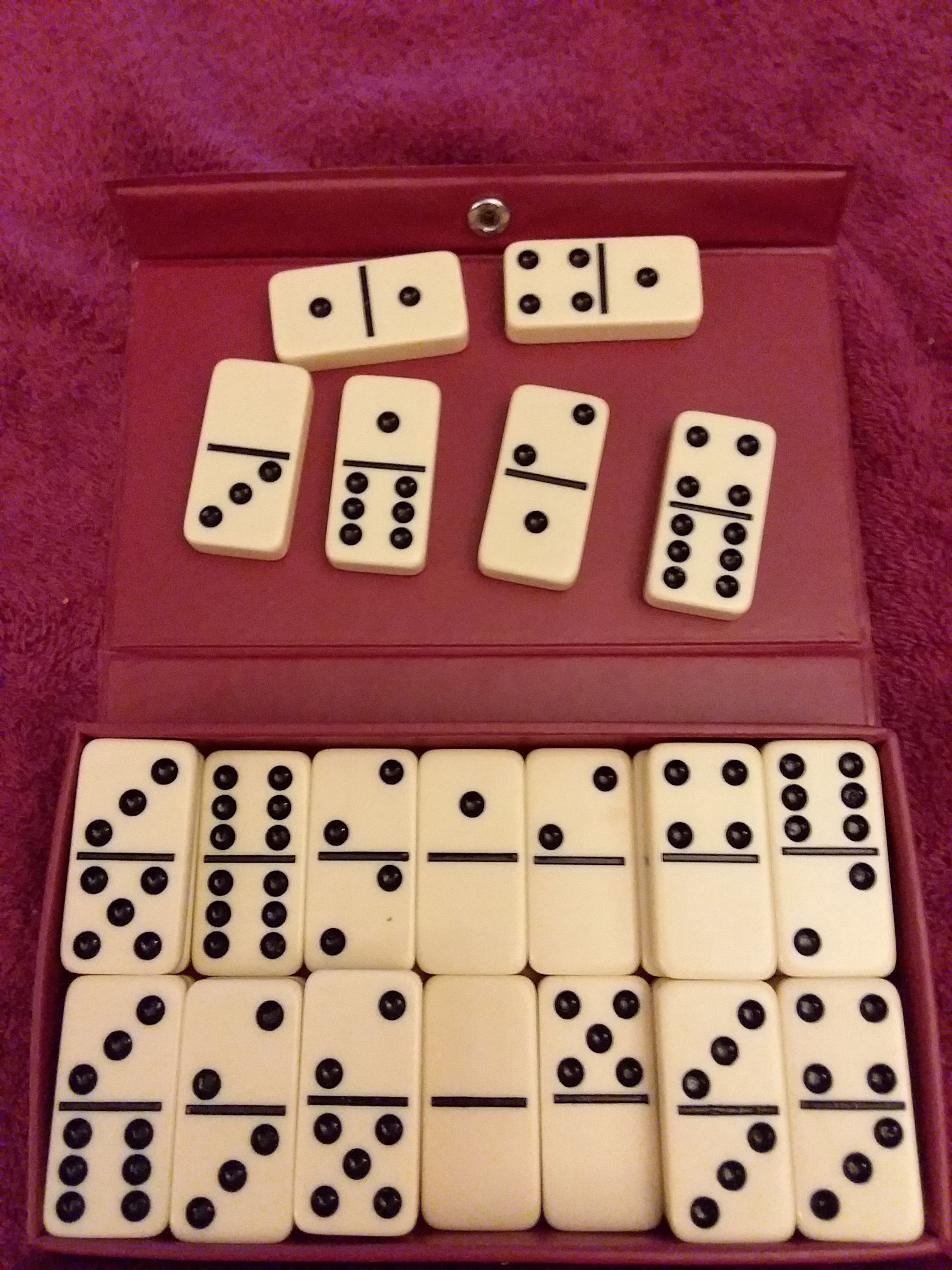 VINTAGE DOMINOES DOUBLE SIX 28 PIECE SET BY CARDINAL IN RED VINYL CASE.