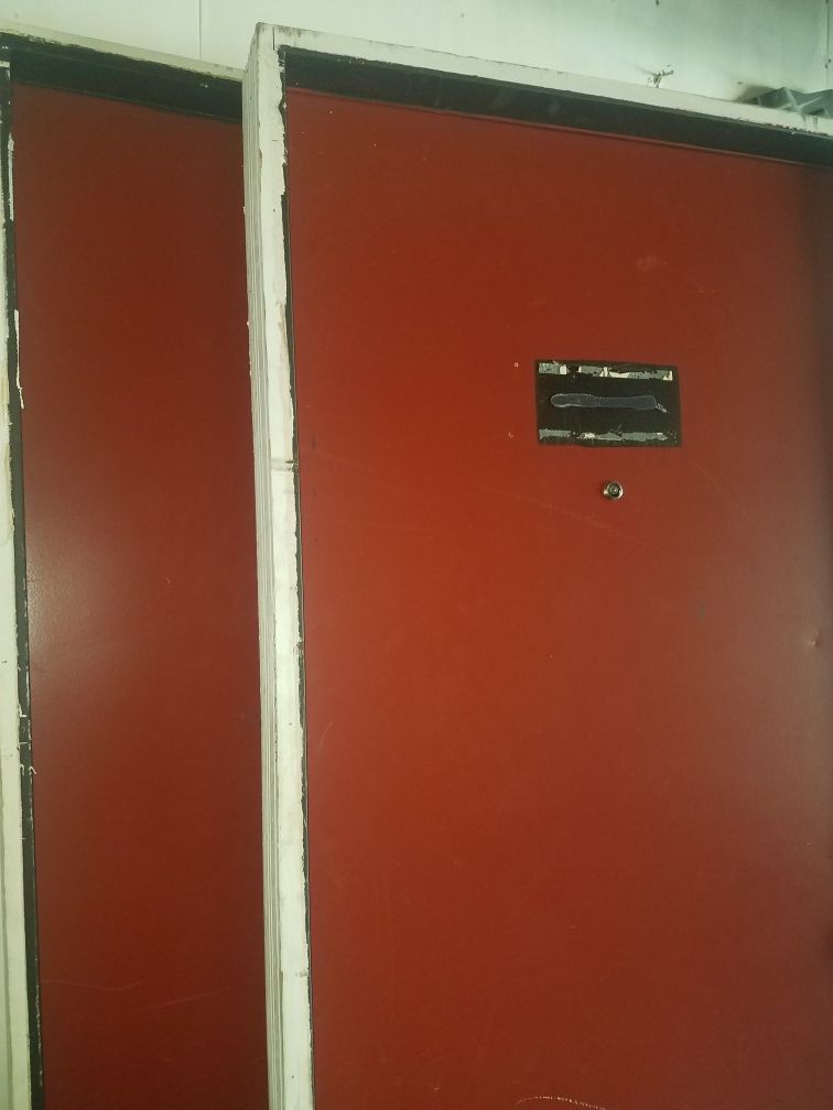 Metal door with frame and locks